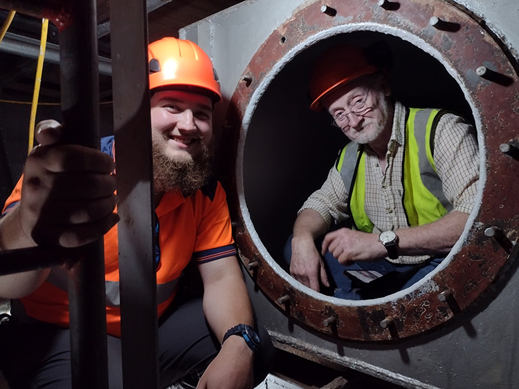 Chris and Charlie inspect the 'Sanitary Tank'.  Yes, it did contain what you think it did, but had been cleaned and repainted.